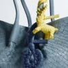 Pendentif nœud en forme de coquillage