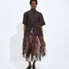 Jupe en cuir et broderie à franges