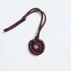 Pendentif nœud en forme de coquillage