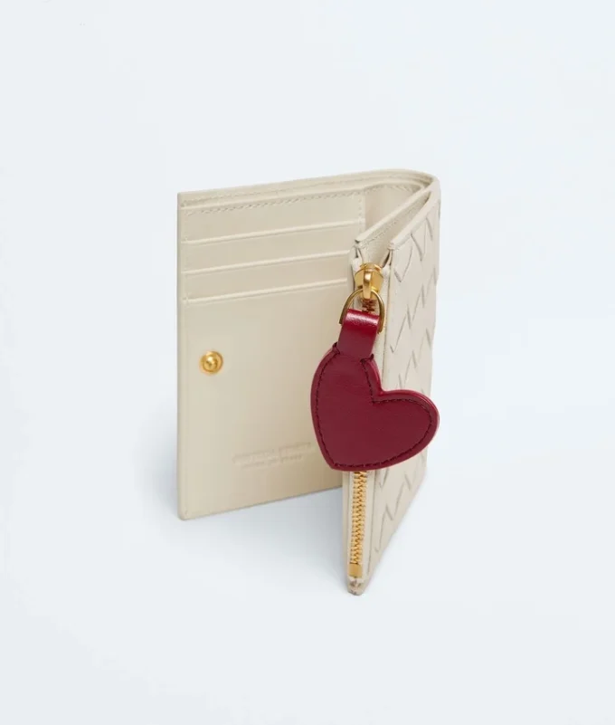 Petit portefeuille à deux volets en cuir Intrecciato