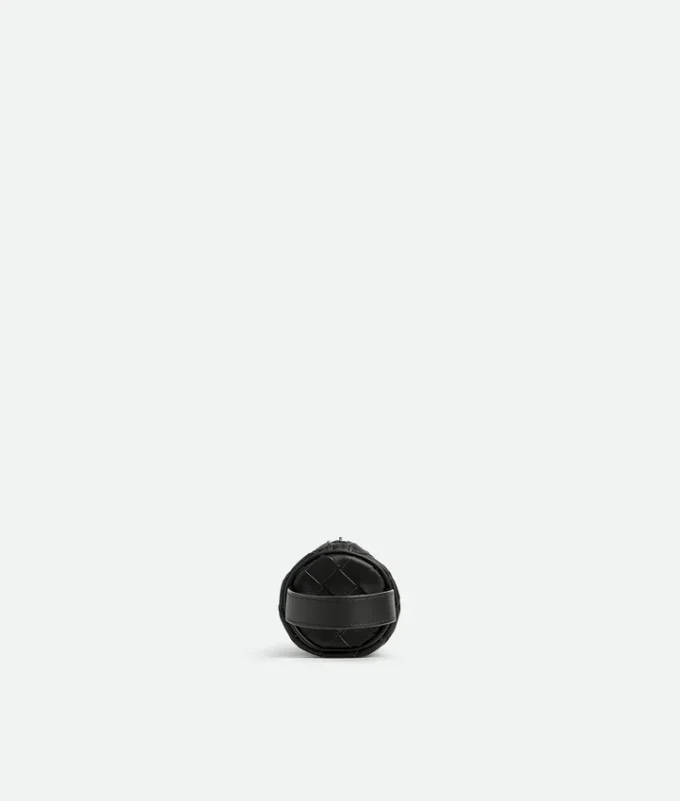 Trousse cylindrique en cuir Intrecciato